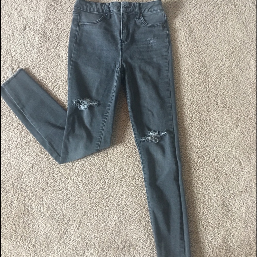 extra high rise. grey ripped jeans. used.